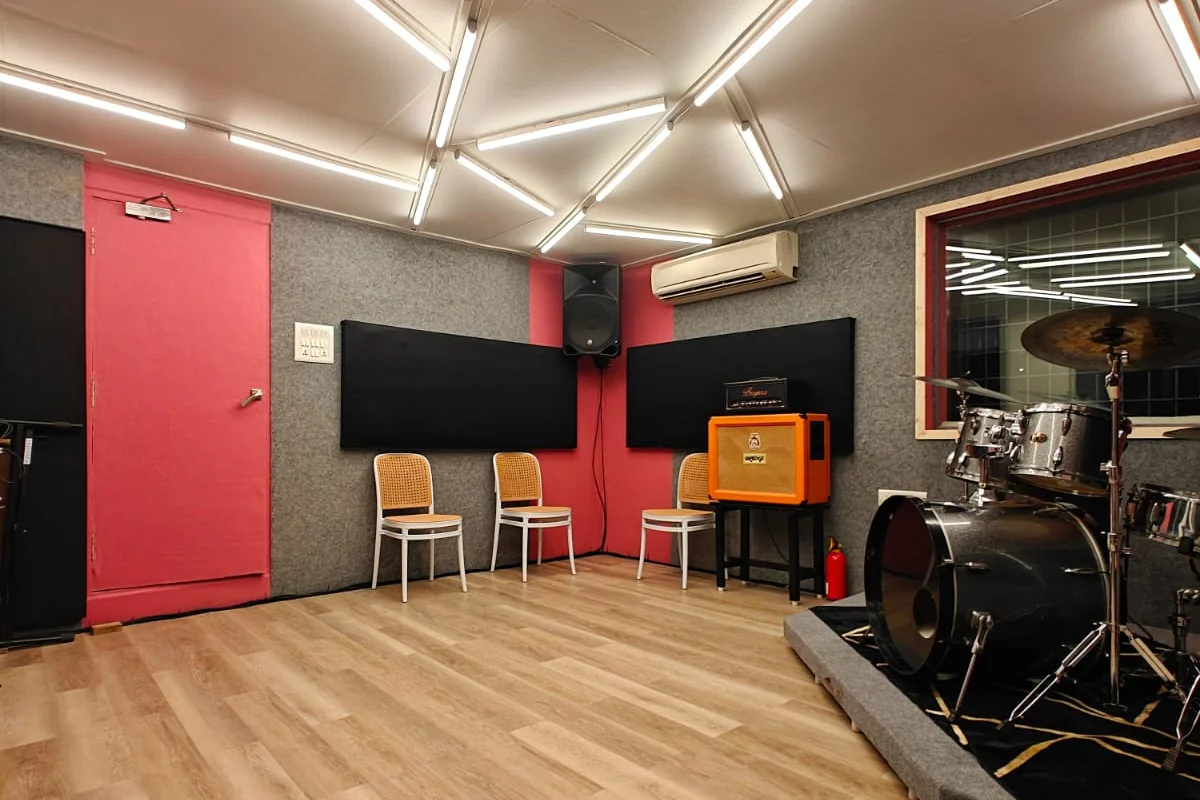 Jam room with acoustic wall panels and ceiling treatment